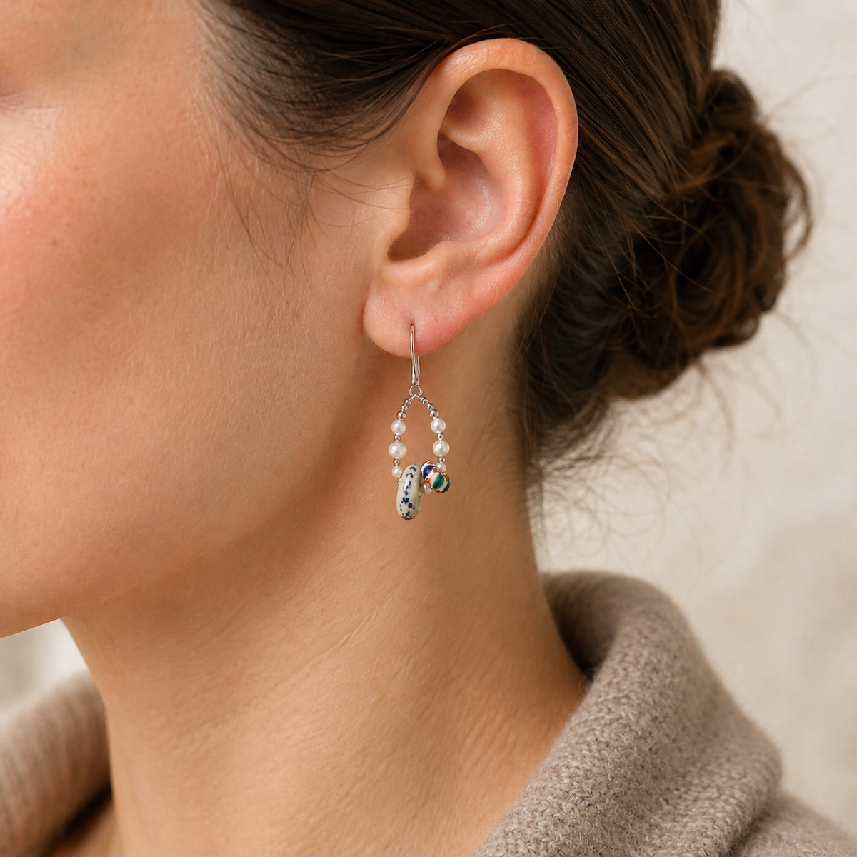 Model wearing Silver Himalayan Glass Pearl Hoop Earrings with tailored styling