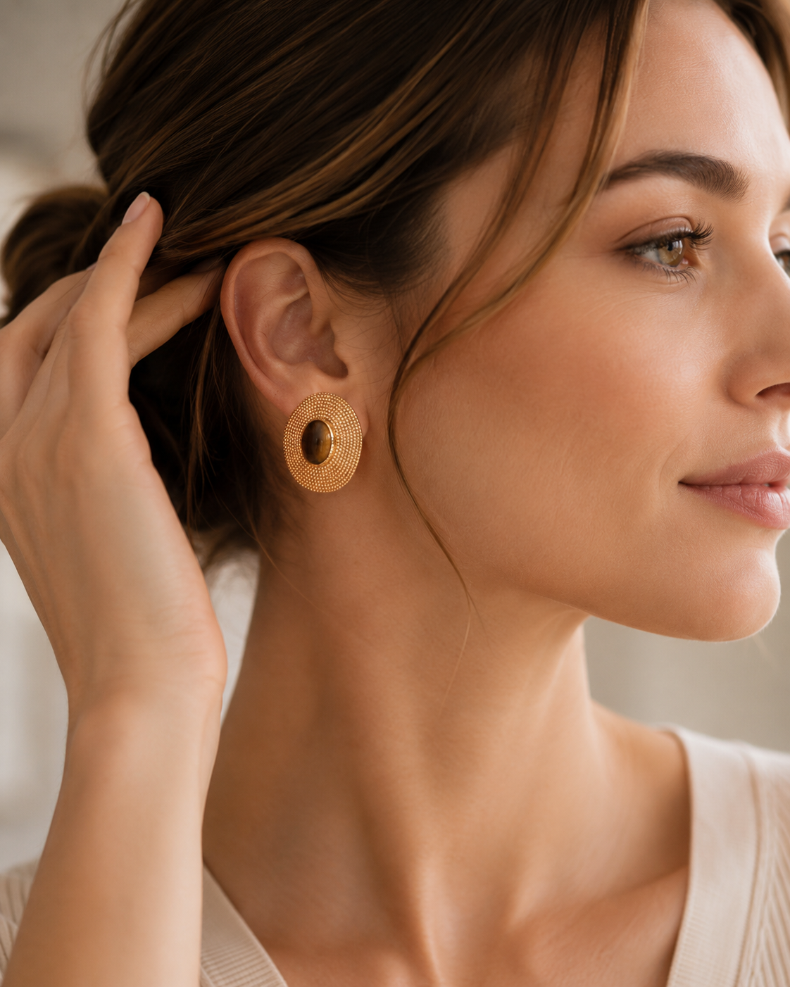 Close-up of vintage gold tiger eye S925 silver stud earring