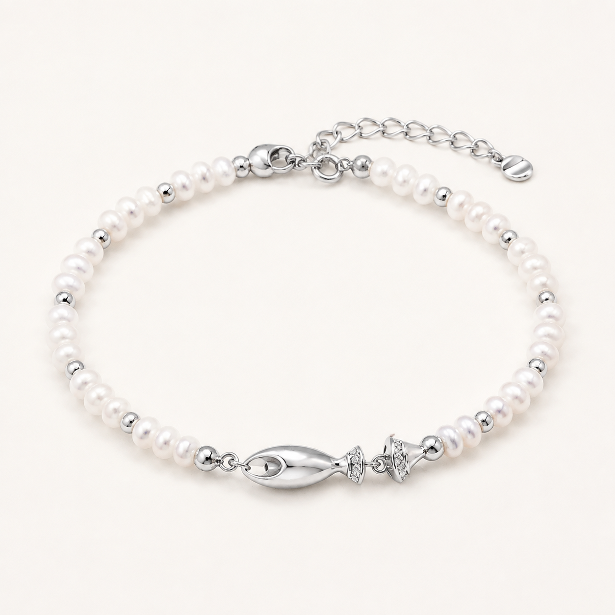 Silver natural pearl fish bracelet on a white background