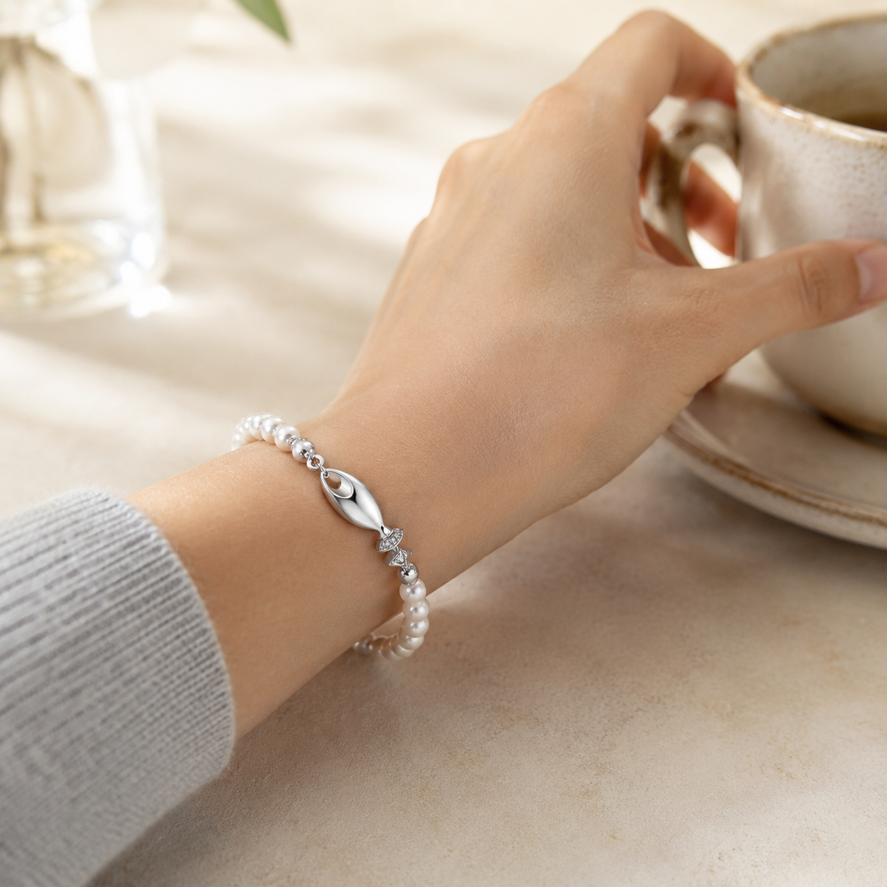 Model wearing the Silver natural pearl fish bracelet
