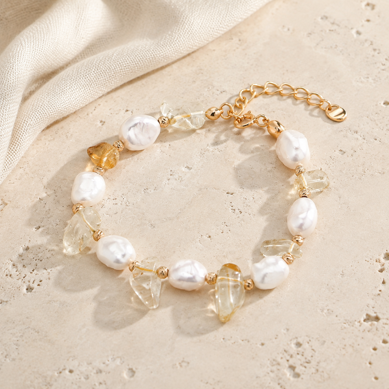 Full Vintage Gold Fortune Pearl Crystal Bracelet on an ivory stone surface