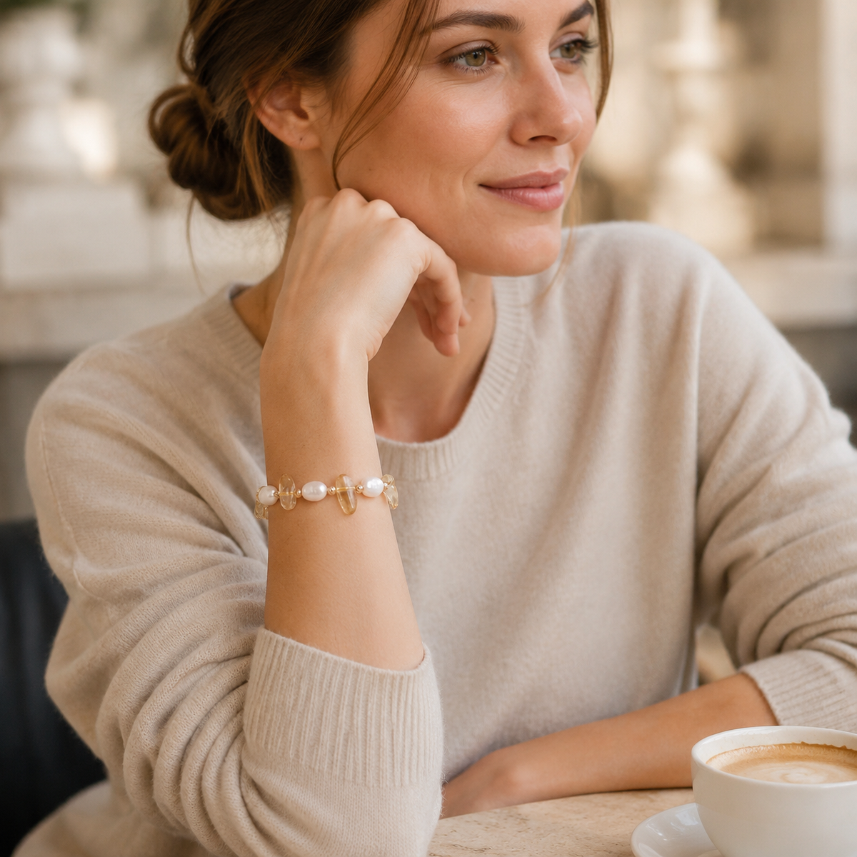 Model wearing the Vintage Gold Fortune Pearl Crystal Bracelet with a cream knit