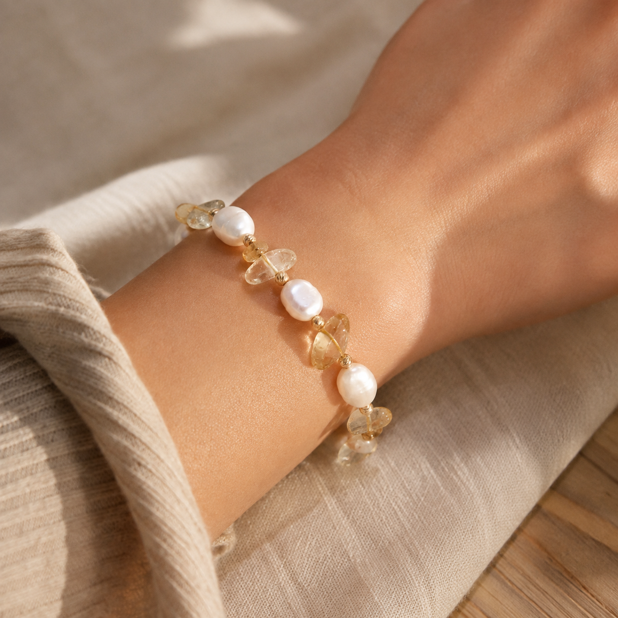 Close wrist view of natural pearls and crystal beads on the Vintage Gold bracelet