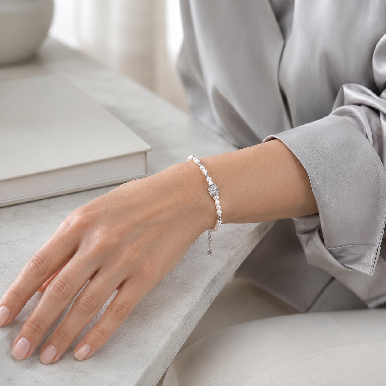 Close wrist view of the Silver Fortune Turn Pearl Bracelet
