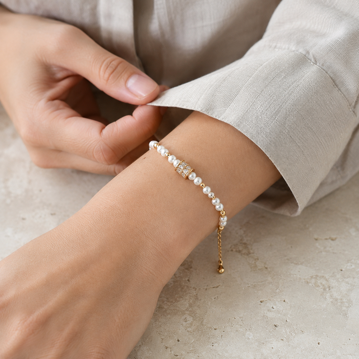 Close wrist view of the Vintage Gold Fortune Turn Pearl Bracelet