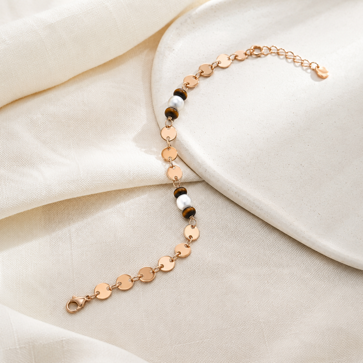 Vintage Gold tiger eye and pearl bracelet on textured fabric