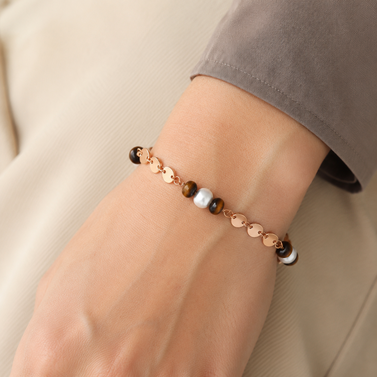 Close wrist view of the Vintage Gold tiger eye and pearl bracelet
