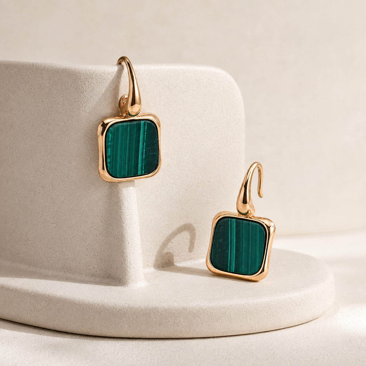 Vintage Gold malachite drop earrings with a sculptural display