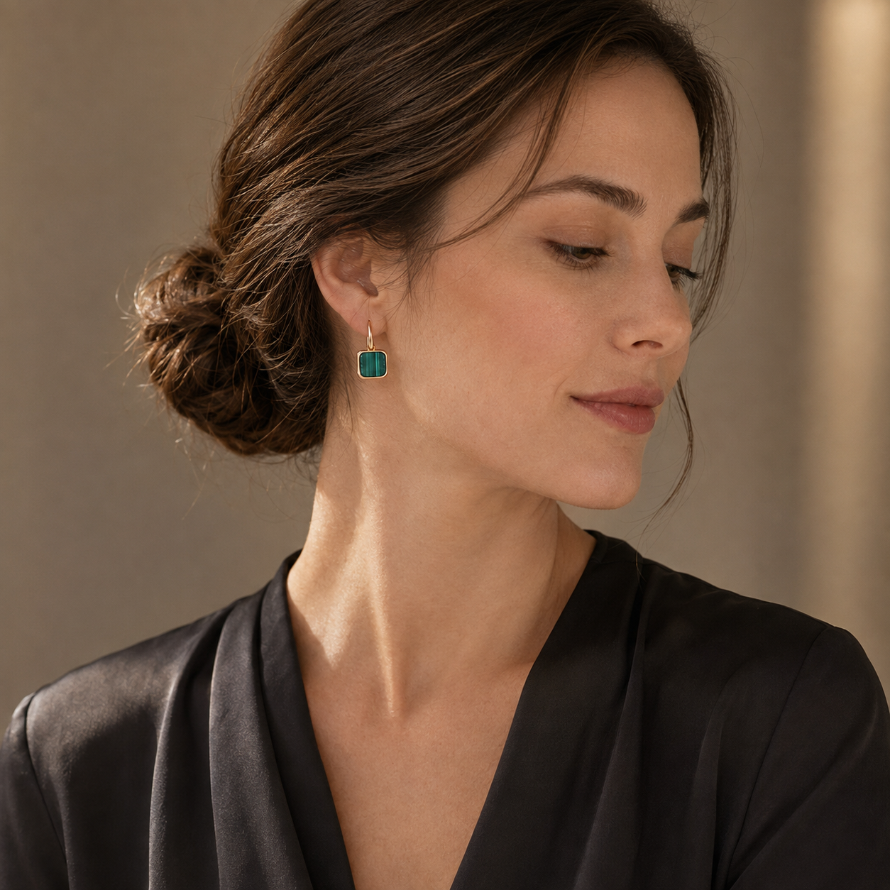 Model wearing Vintage Gold malachite drop earrings in evening styling