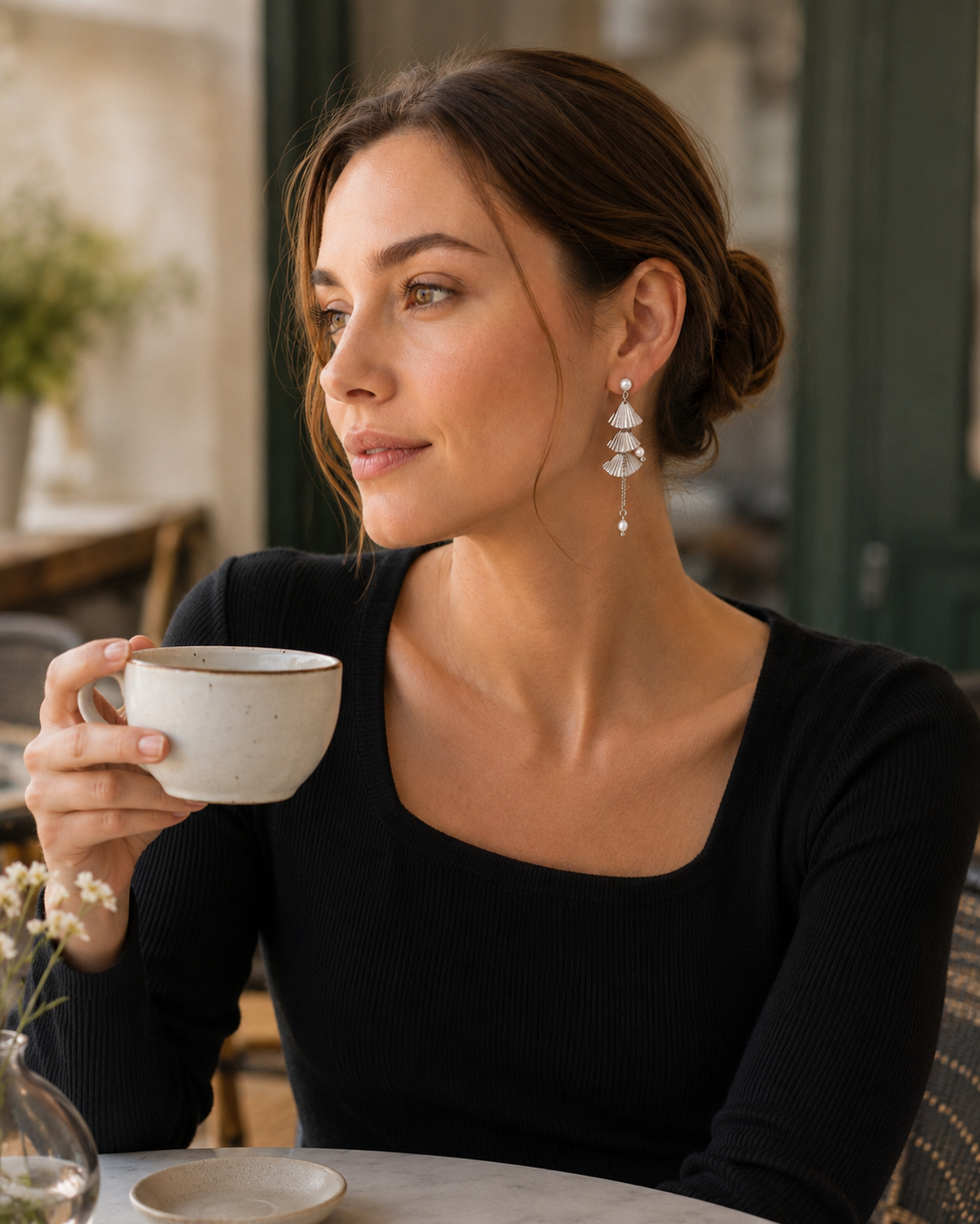 Model wearing white gold layered fan pearl earrings