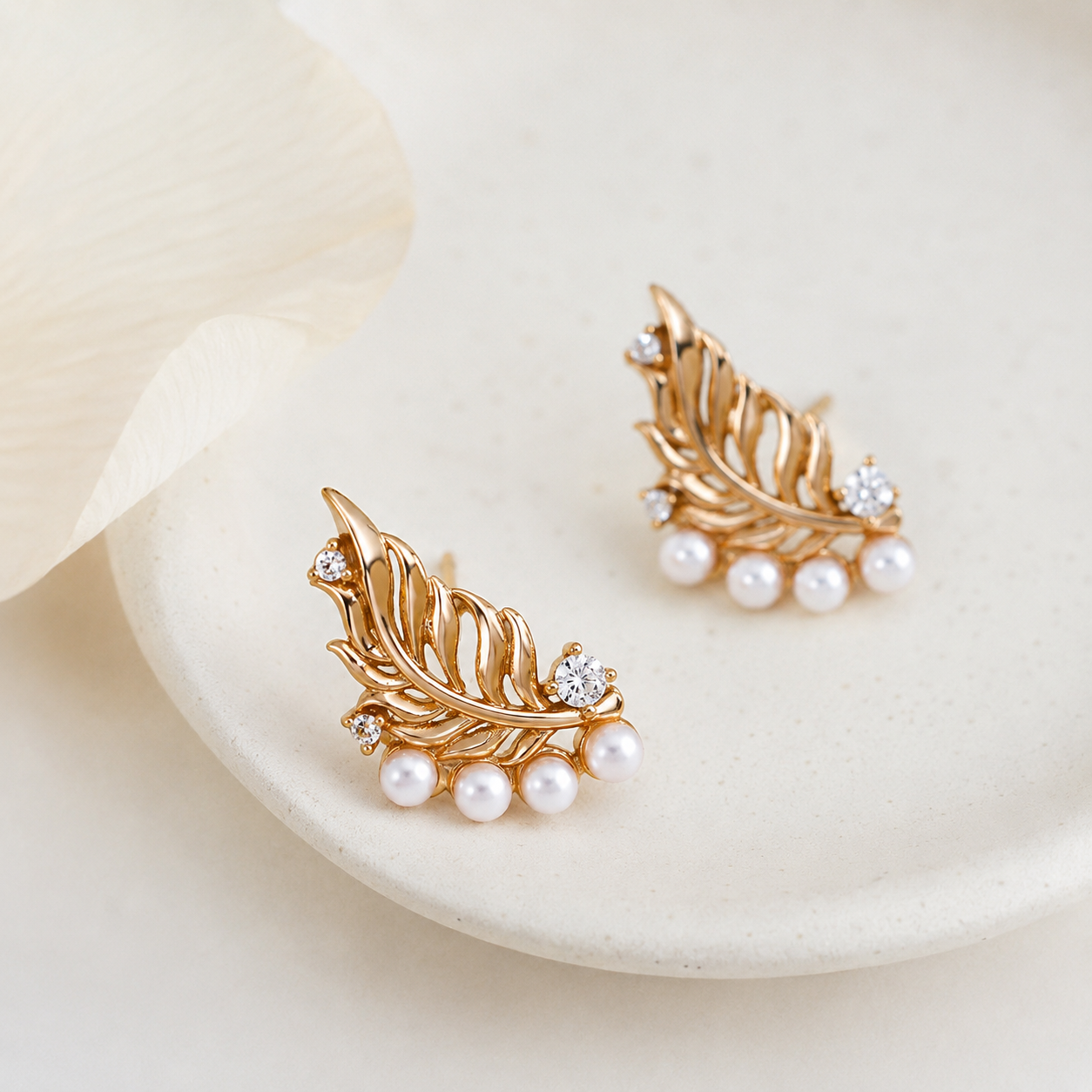 Close product view of Vintage Gold feather pearl stud earrings