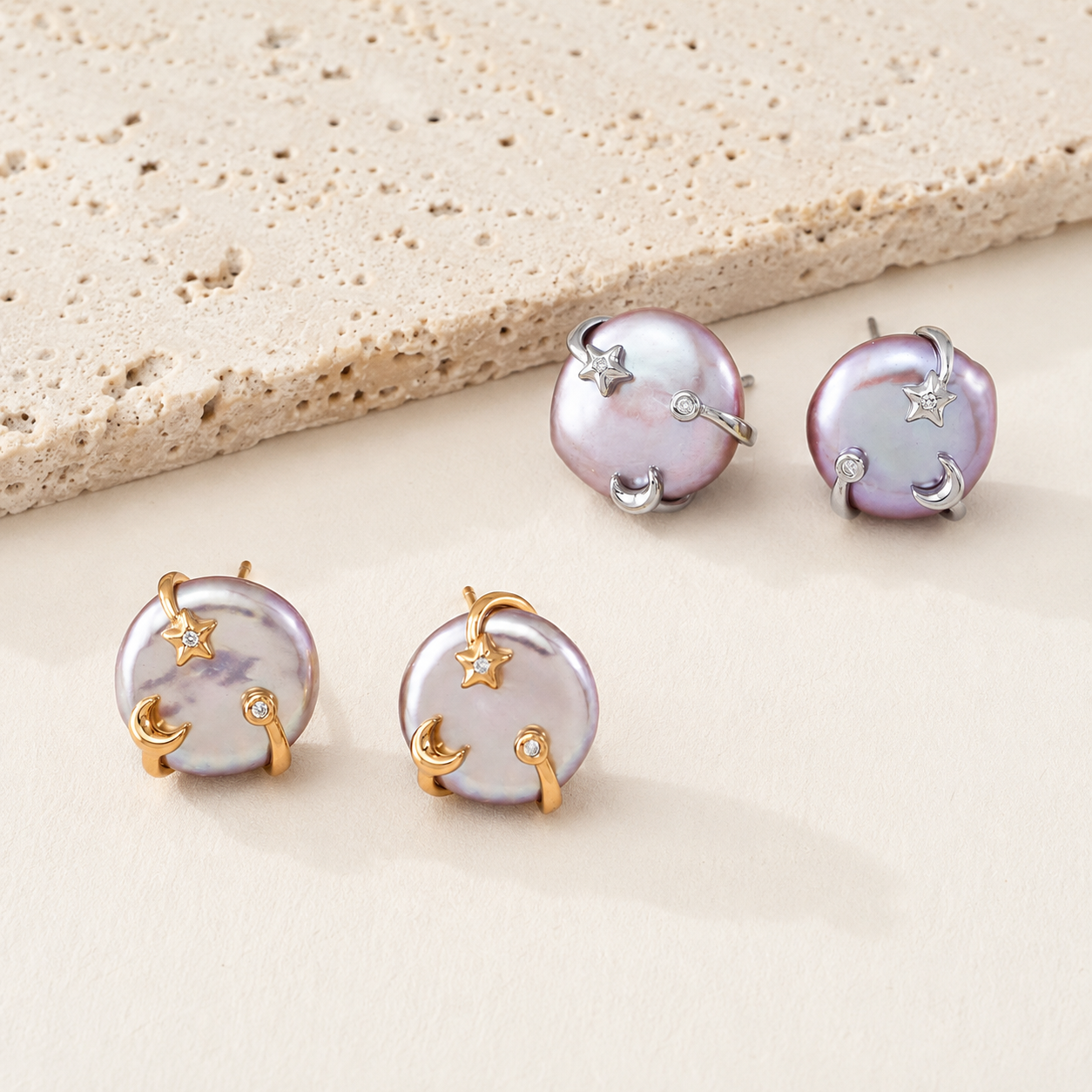 Vintage Gold and Silver Wish Pearl Earrings shown together on an ivory display