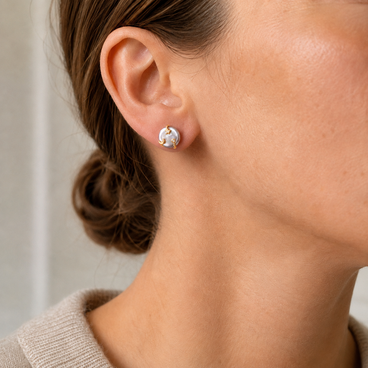 Close ear view of a model wearing Vintage Gold Wish Pearl Earrings