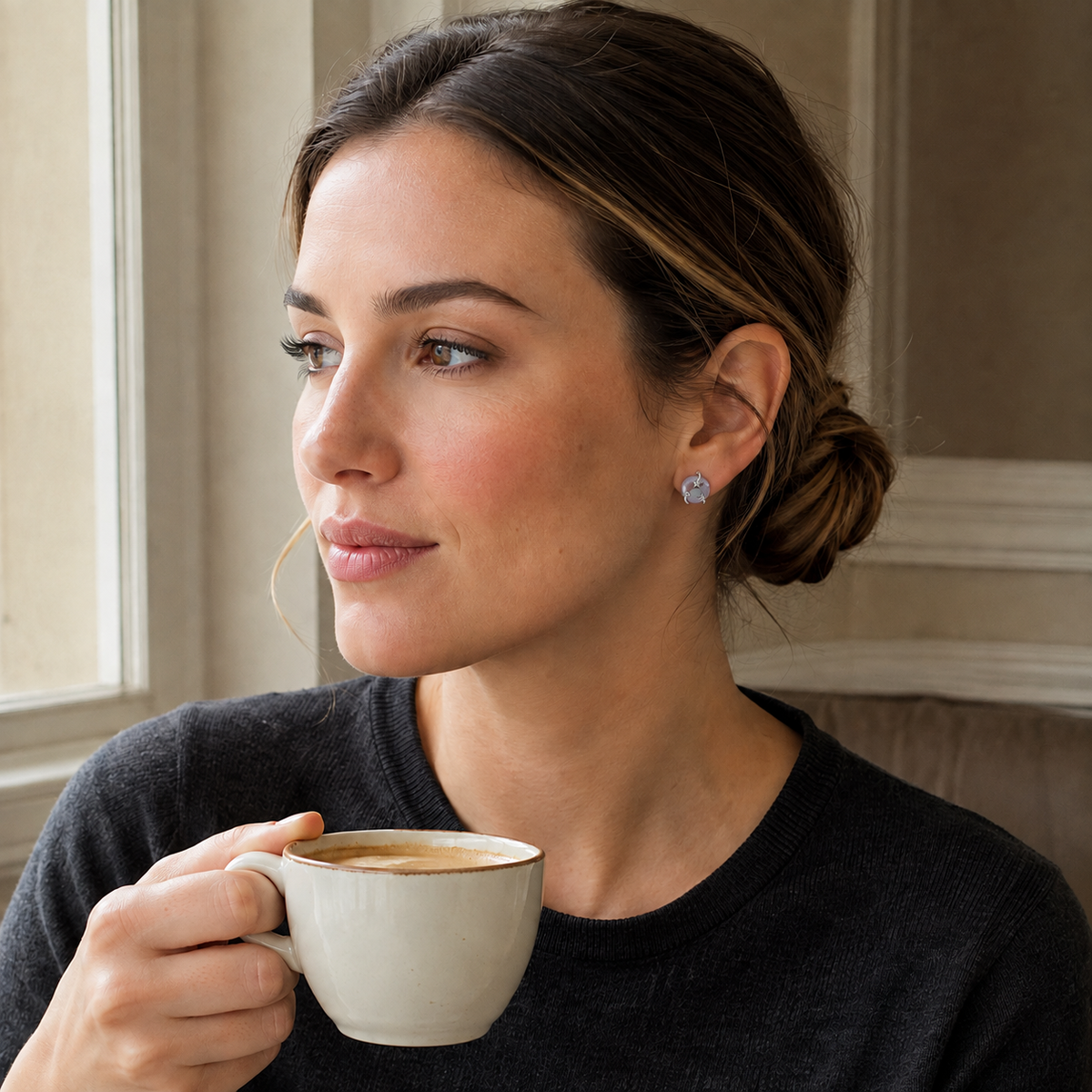 Model wearing Silver Wish Pearl Earrings with a dark knit top