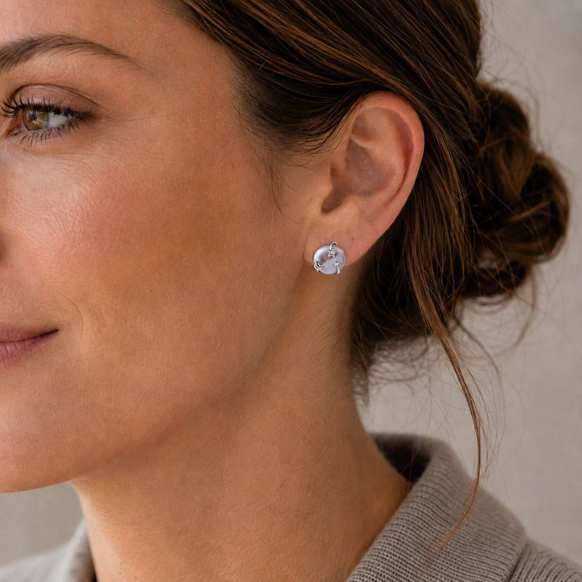 Close ear view of a model wearing Silver Wish Pearl Earrings