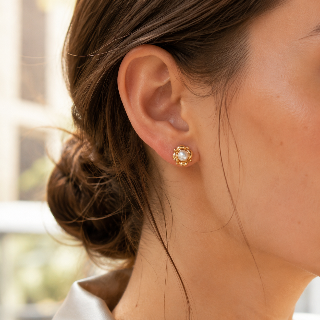 Close ear view of the Vintage Gold Orbit Pearl Stud Earring