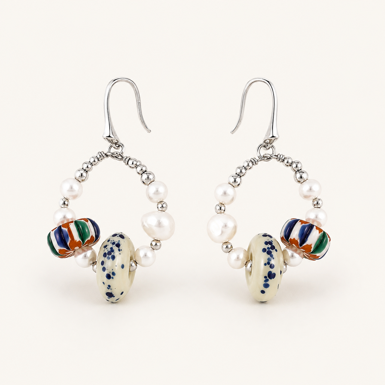 Silver Himalayan Glass Pearl Hoop Earrings front view on a light background