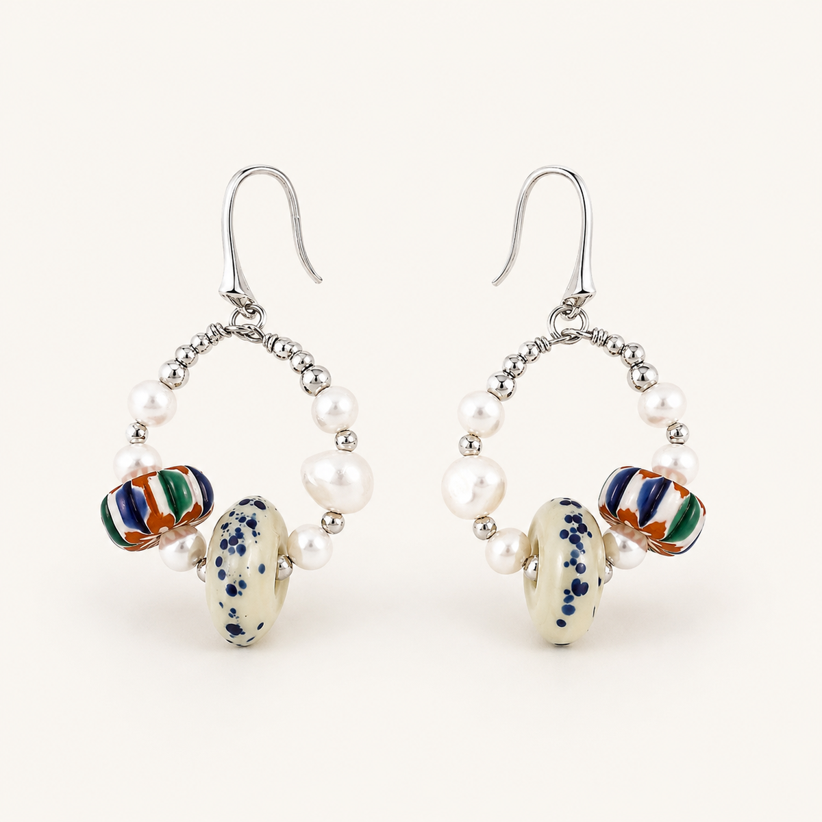 Silver Himalayan Glass Pearl Hoop Earrings front view on a light background