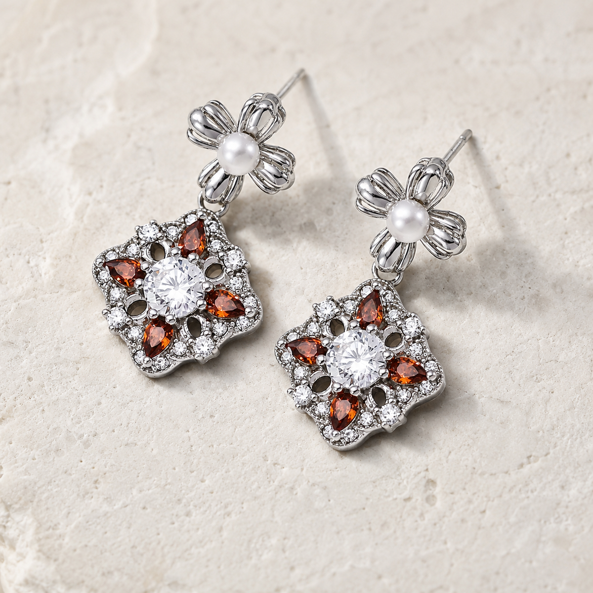Silver auspicious bloom pearl drop earrings shown as a pair