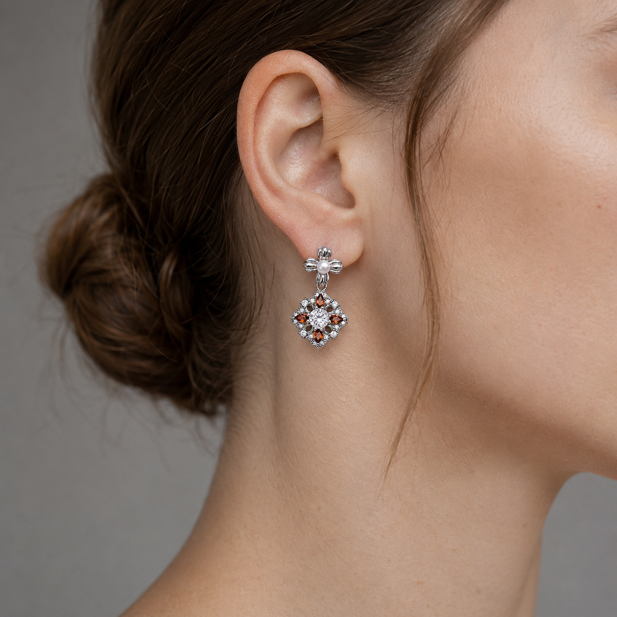 Close ear view of the Silver auspicious bloom pearl drop earring