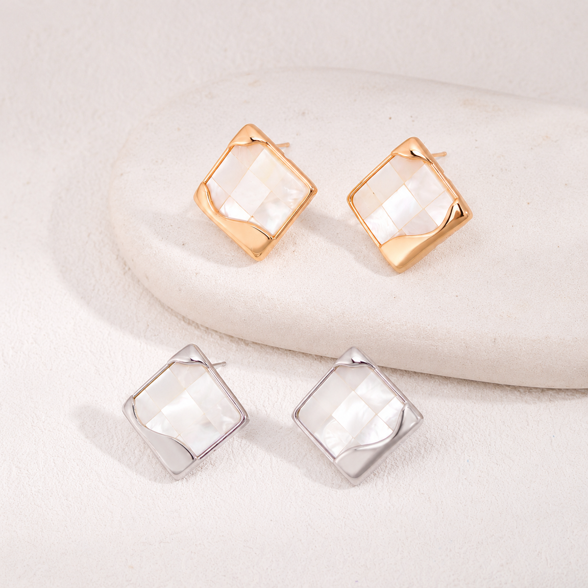 Vintage Gold and Silver shell mosaic stud earrings shown together