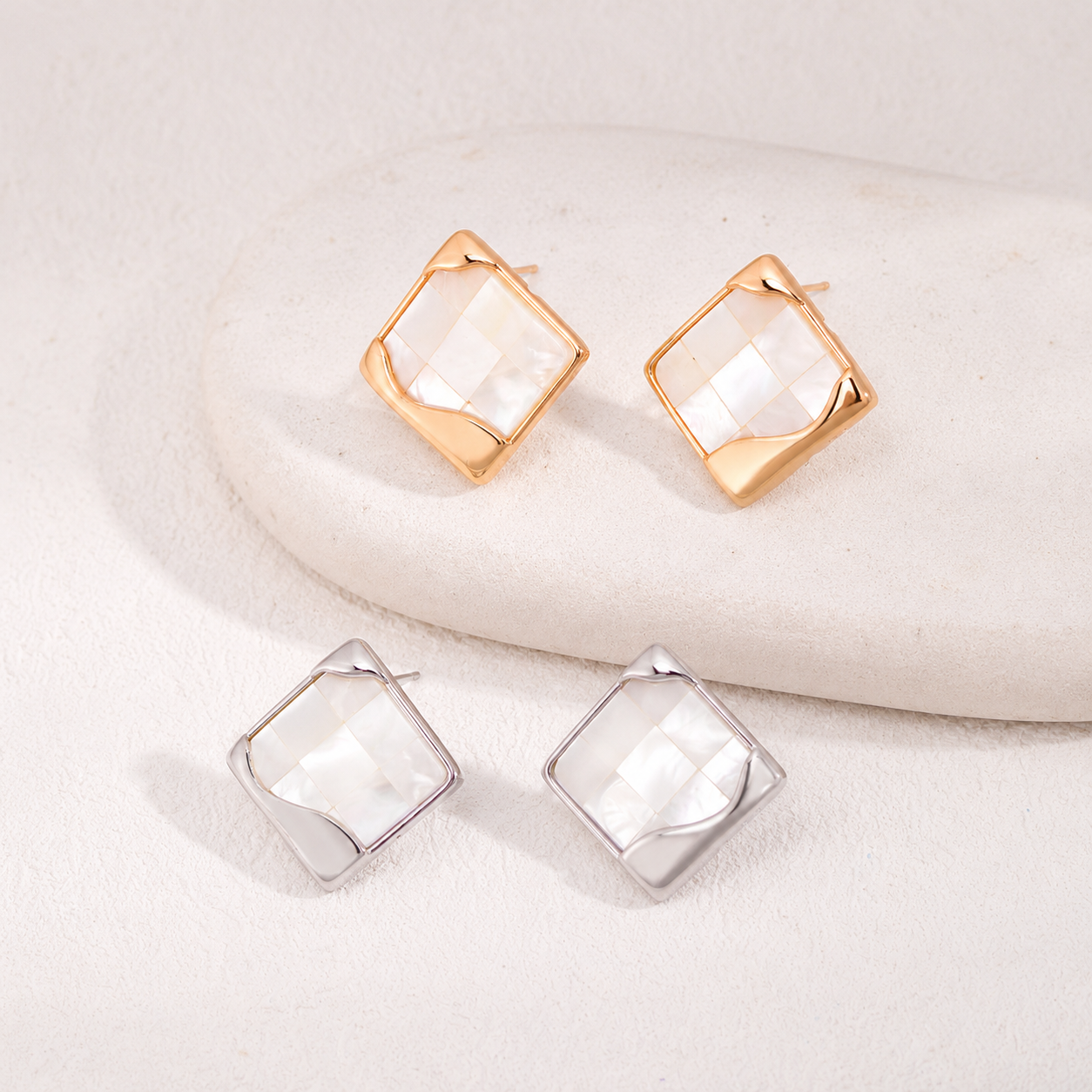 Vintage Gold and Silver shell mosaic stud earrings shown together