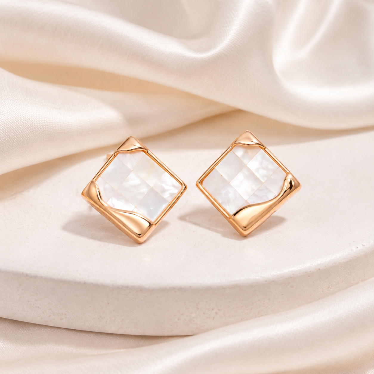 Vintage Gold shell mosaic stud earrings on a silk backdrop