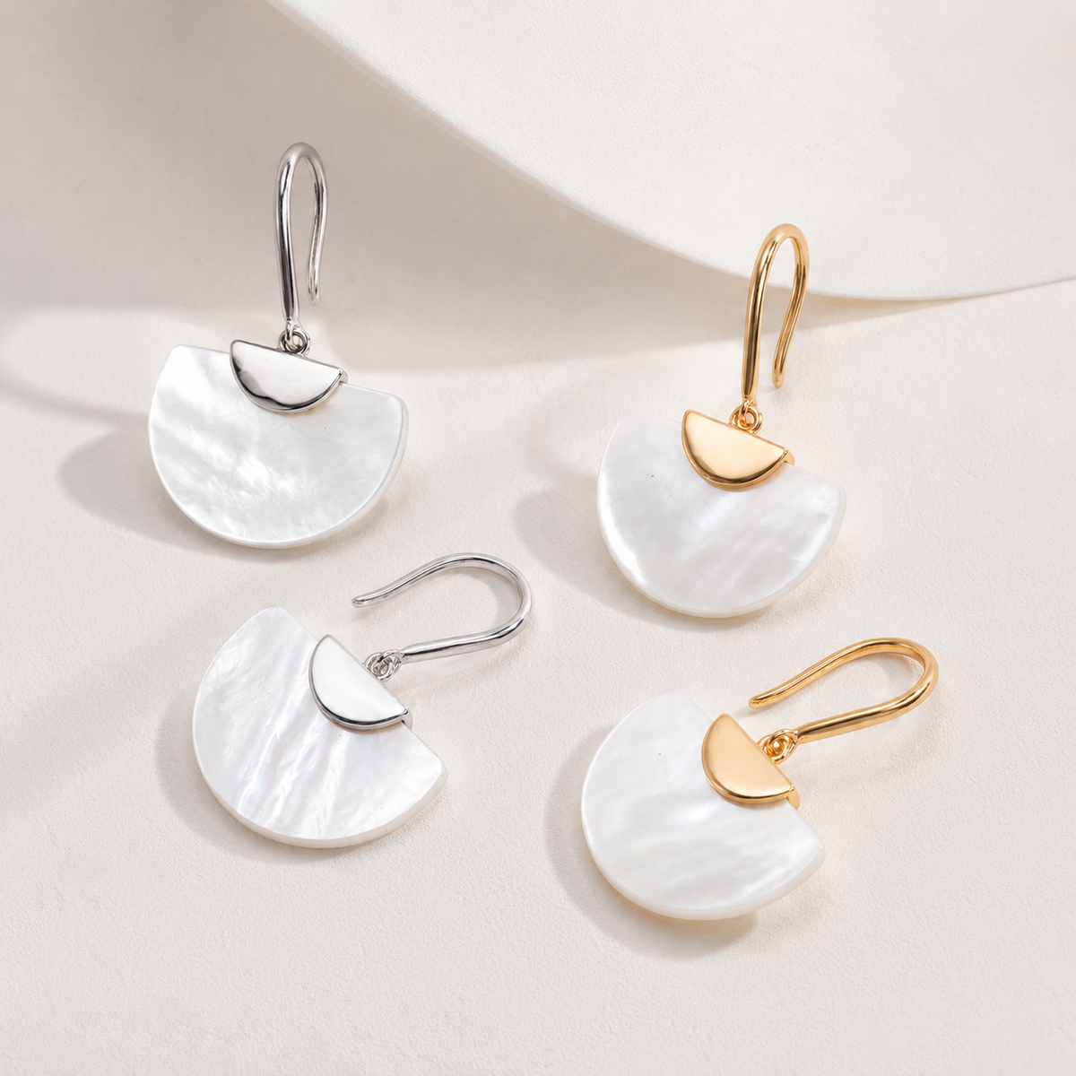 Mother-of-pearl fan drop earrings in Silver and Vintage Gold, product display