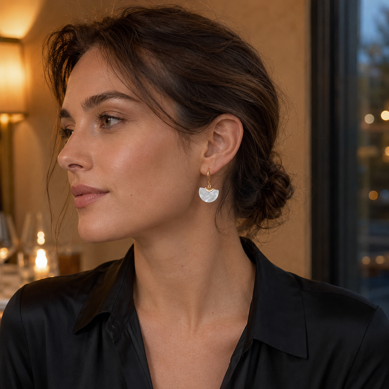 Vintage Gold mother-of-pearl fan drop earrings worn on model in evening light