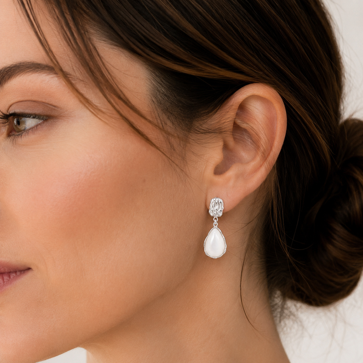 Mother of Pearl drop earrings styled in Silver