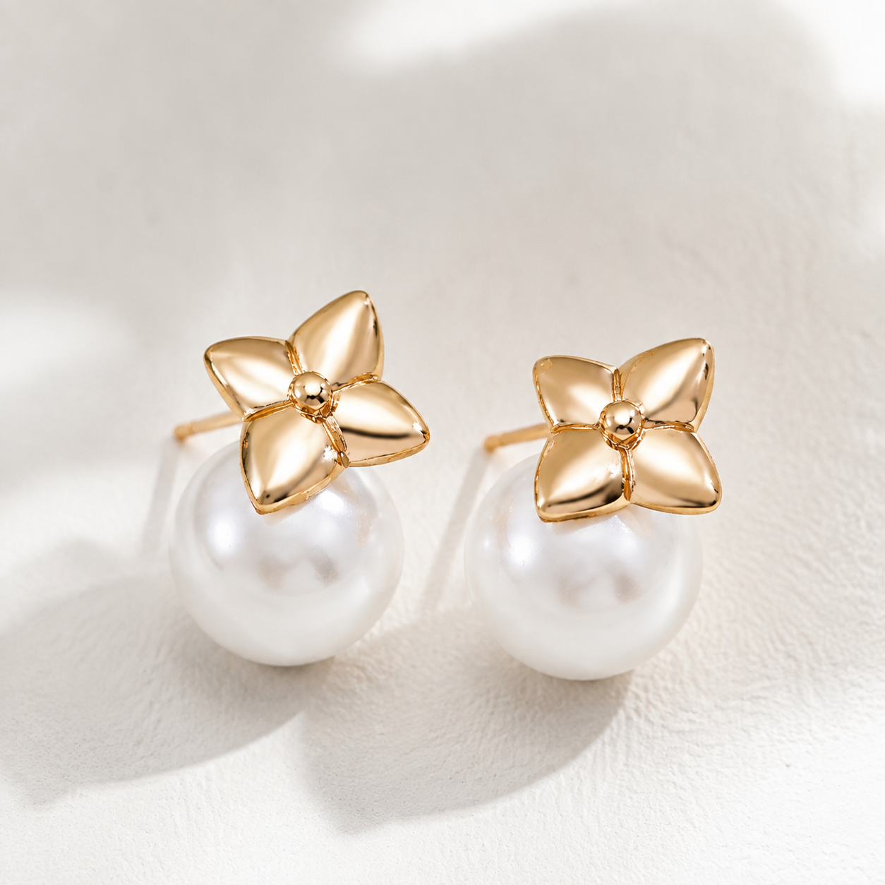 Close product view of Vintage Gold four-leaf shell pearl stud earrings