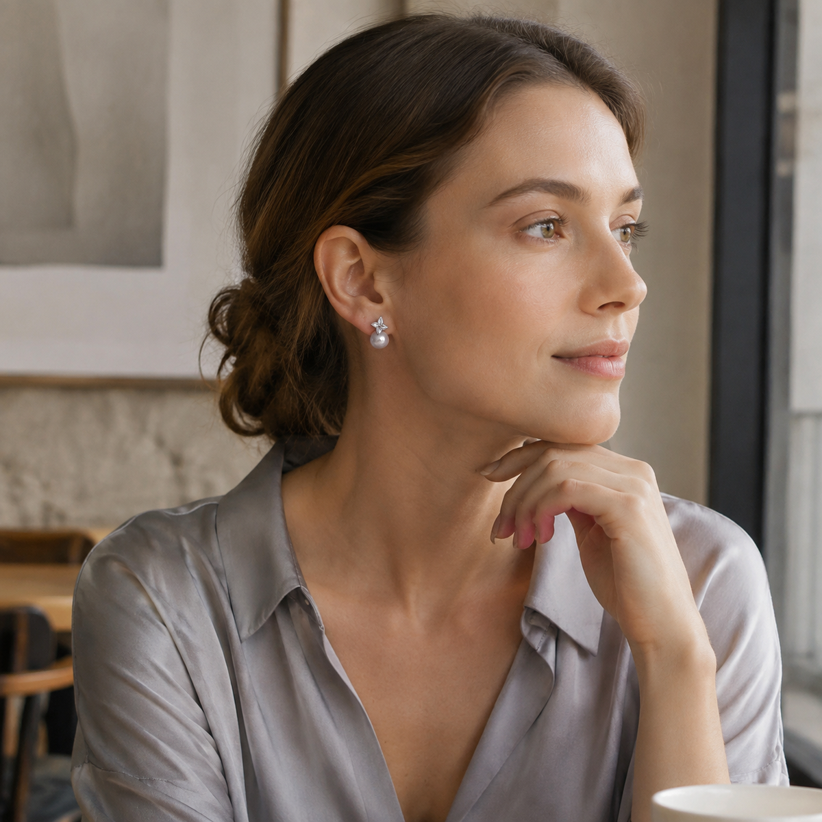 Model wearing Silver four-leaf shell pearl stud earrings