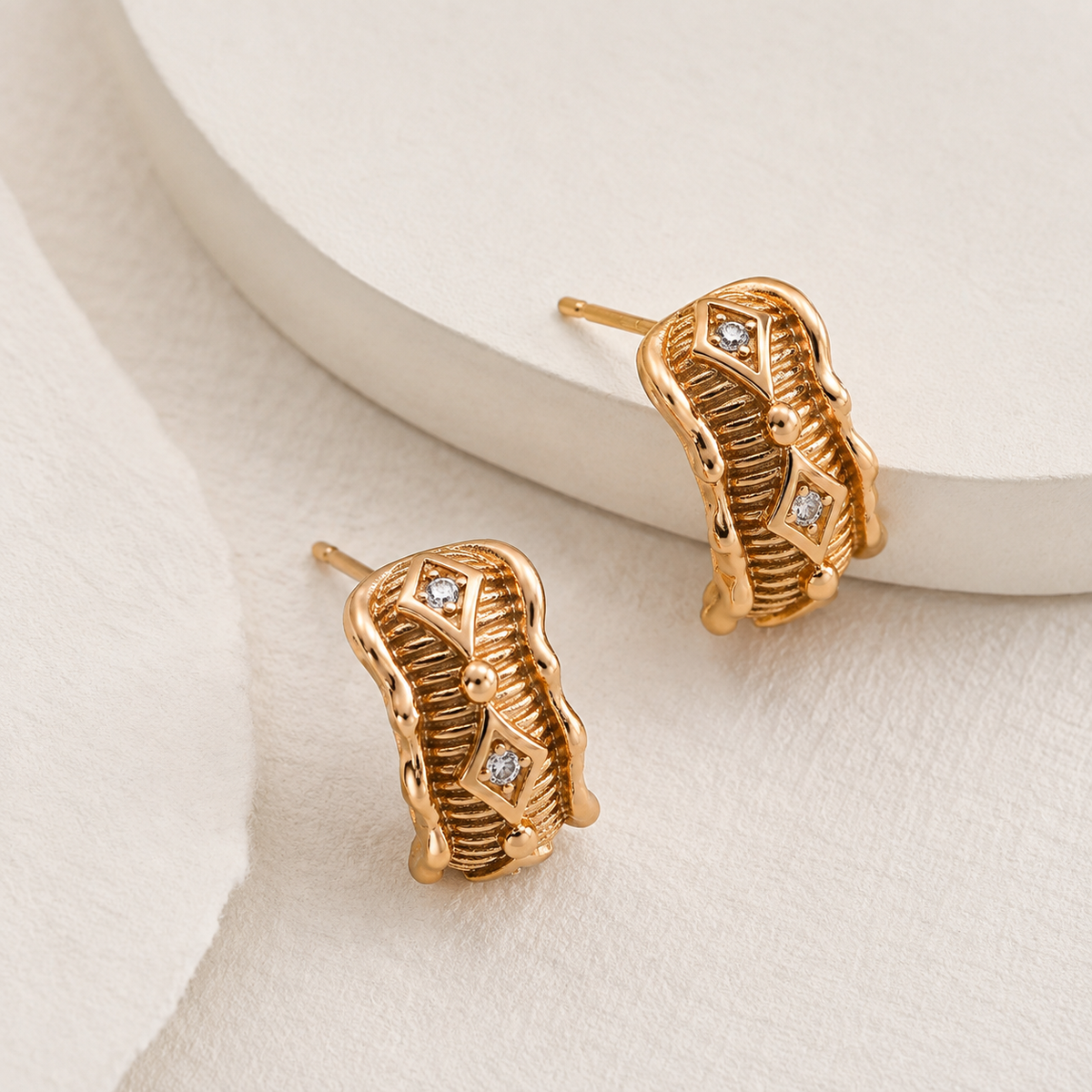 Vintage Gold Vintage Zircon Stud Earrings on ivory satin