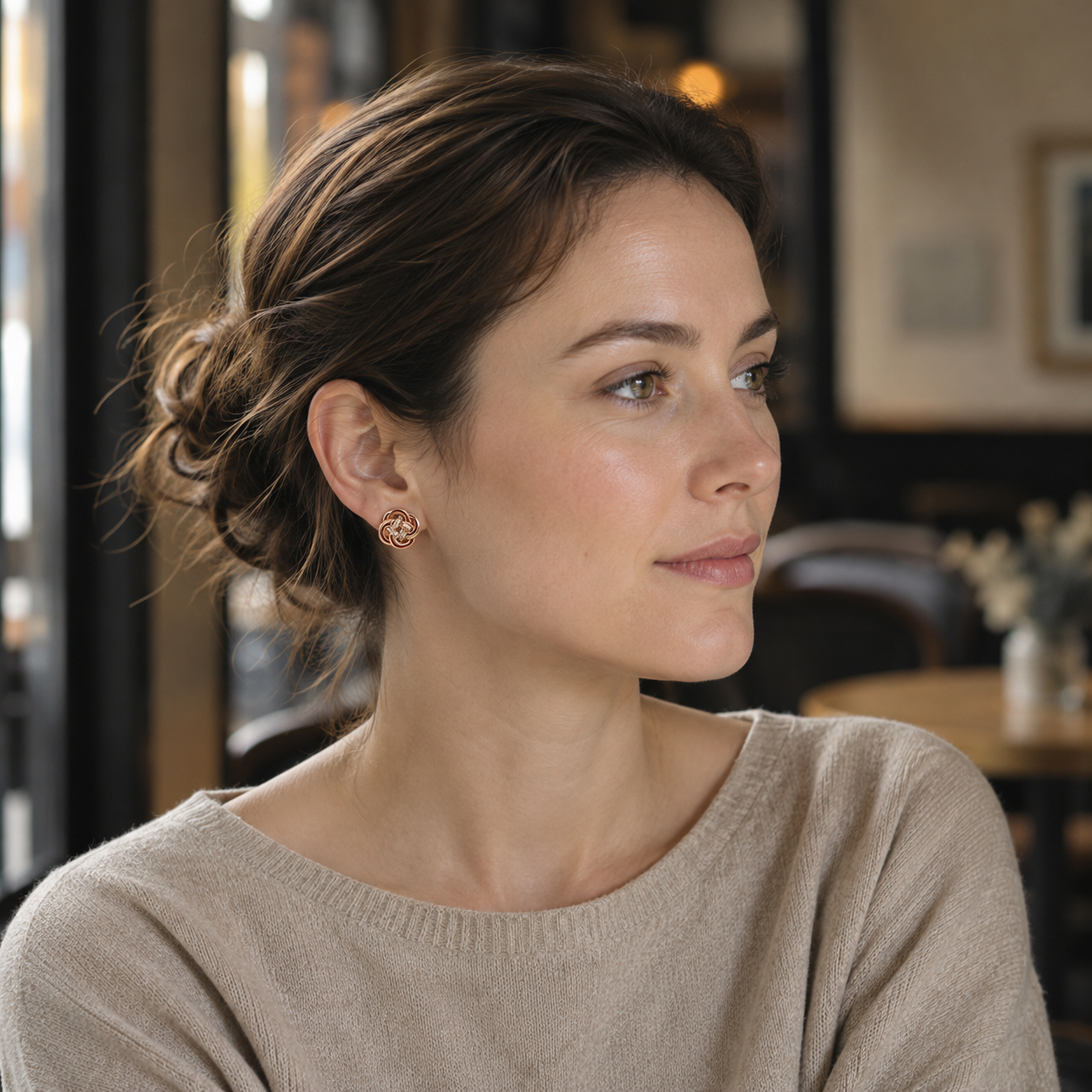 Model wearing Vintage Gold enamel and cubic zirconia knot stud earrings