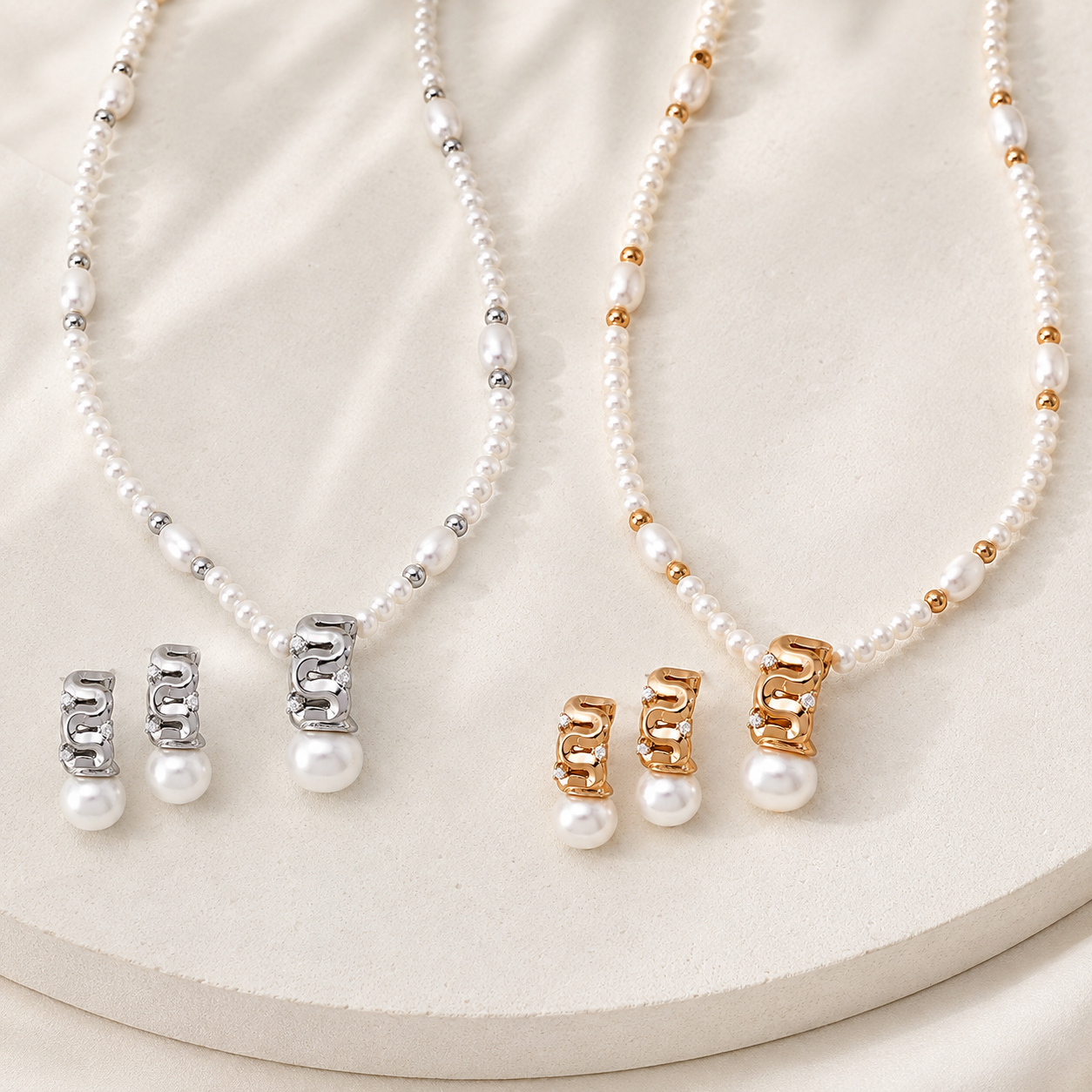 Vintage Gold and Silver sculpted pearl jewelry sets on a stone display