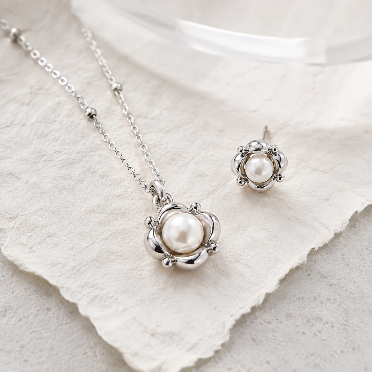Close product view of the Silver Orbit Pearl Necklace and Stud Earring Set