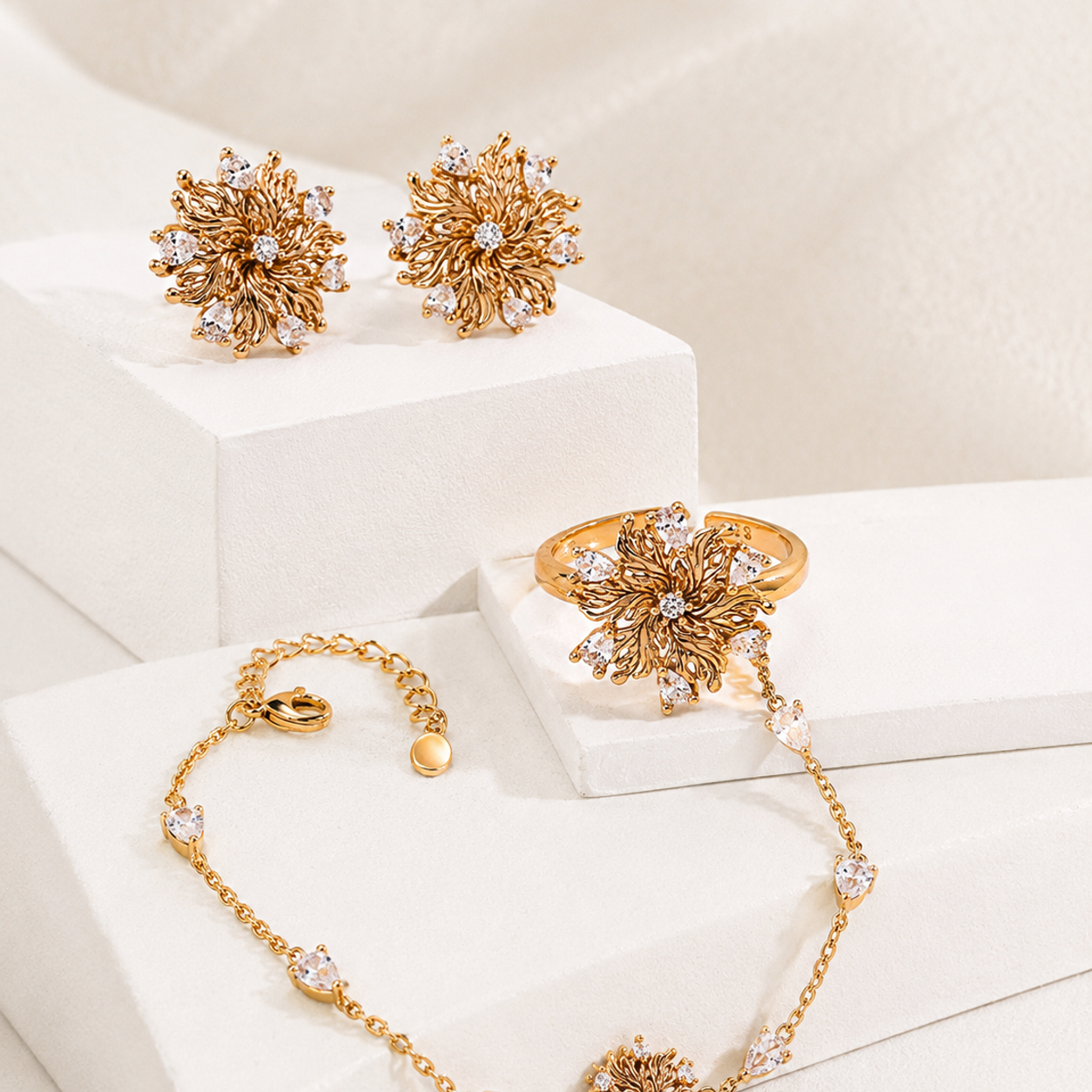 Six-Petal Lily Jewelry Set in Vintage Gold on a sculptural display
