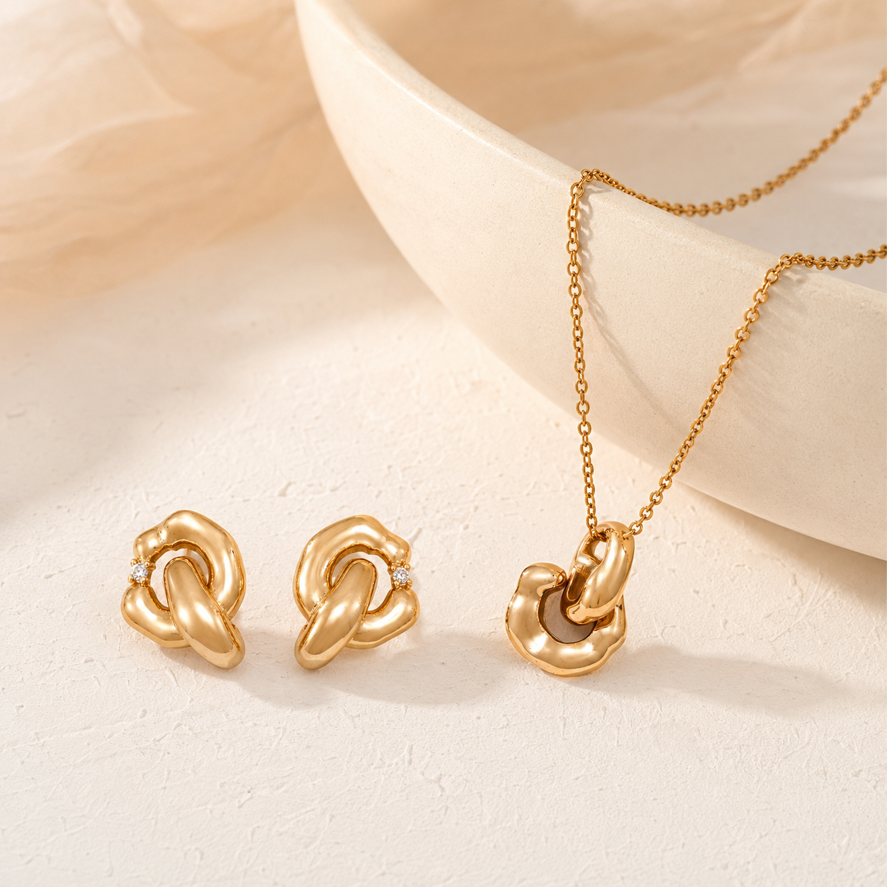 Vintage Gold Interlocking Jewelry Set with pendant necklace and cubic zirconia earrings