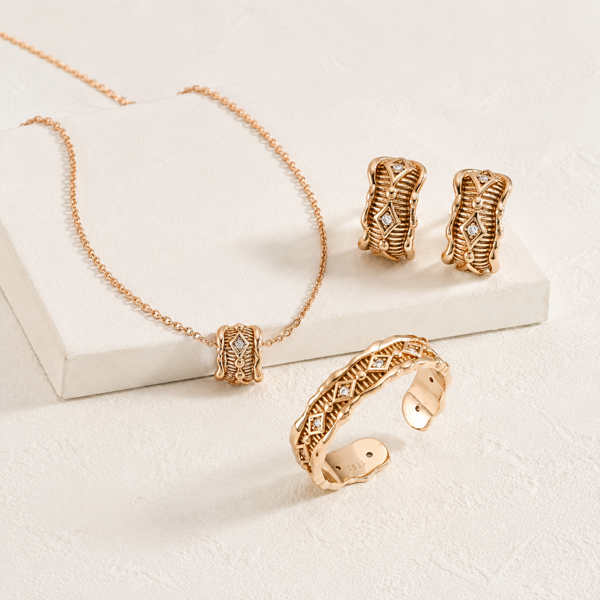 Vintage Gold zircon jewelry set with necklace, ring, and stud earrings on a soft display
