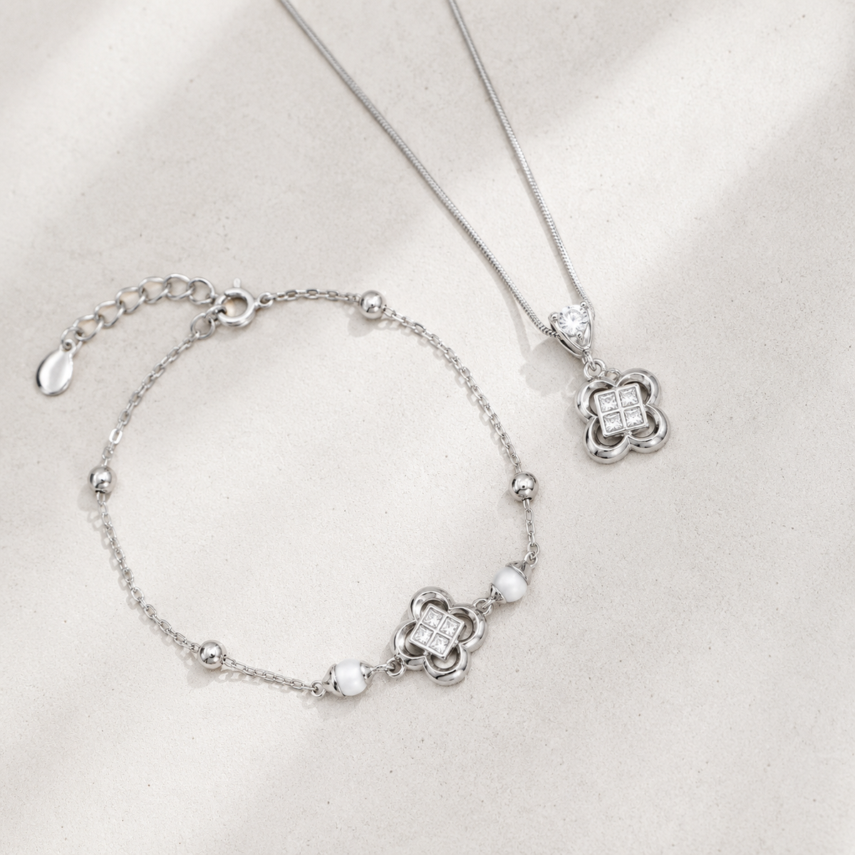 Close view of Silver clover necklace and bracelet jewelry set