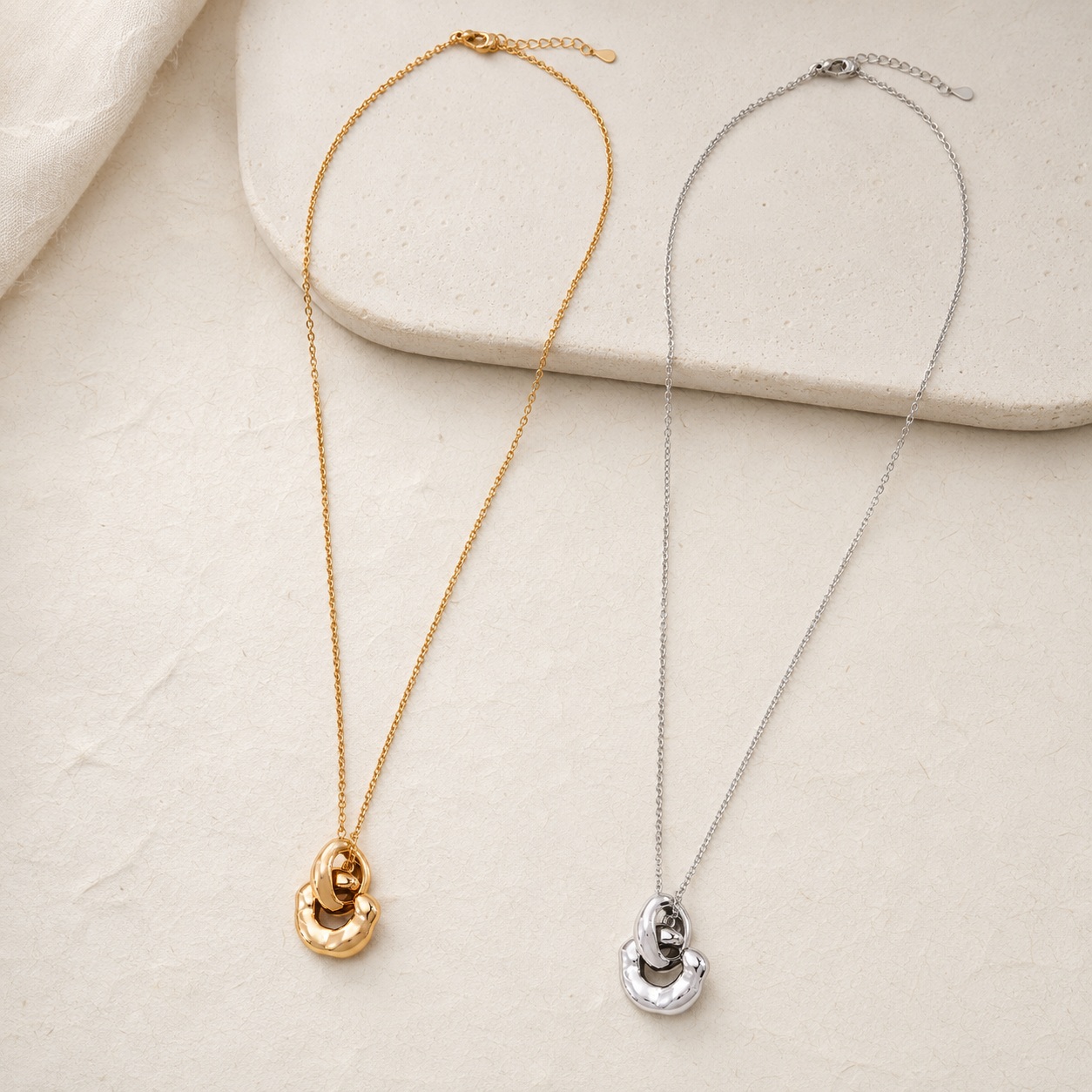 Vintage Gold and Silver Interlocking Pendant Necklaces shown together
