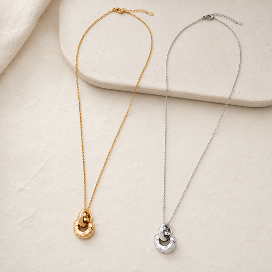 Vintage Gold and Silver Interlocking Pendant Necklaces shown together