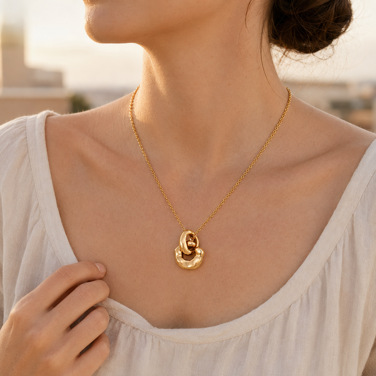 Model wearing Vintage Gold Interlocking Pendant Necklace at the collarbone