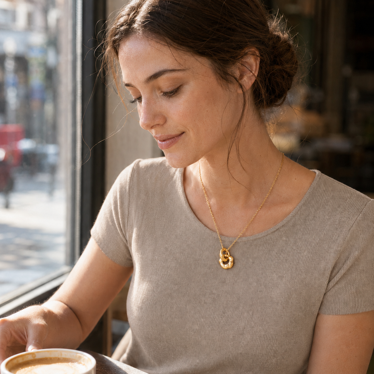 Model wearing Vintage Gold Interlocking Pendant Necklace in an everyday setting