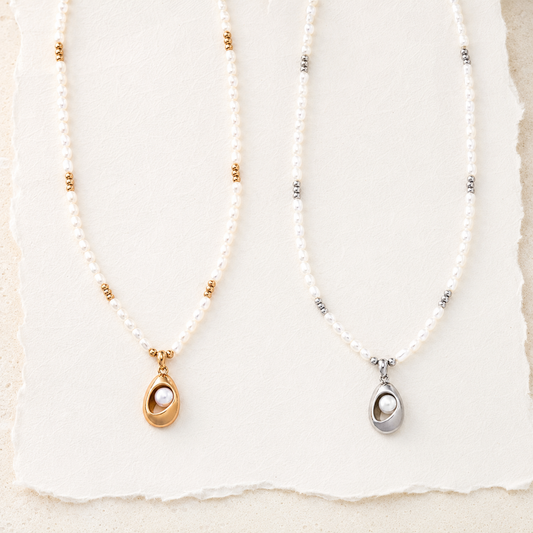 Vintage Gold and Silver natural pearl pendant necklaces flat lay