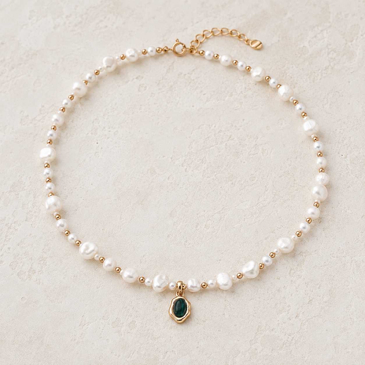 Vintage Gold natural pearl and malachite pendant necklace on an ivory display