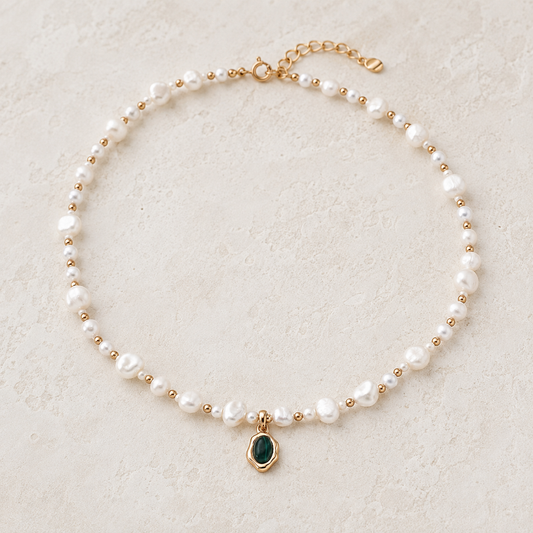 Vintage Gold natural pearl and malachite pendant necklace on an ivory display