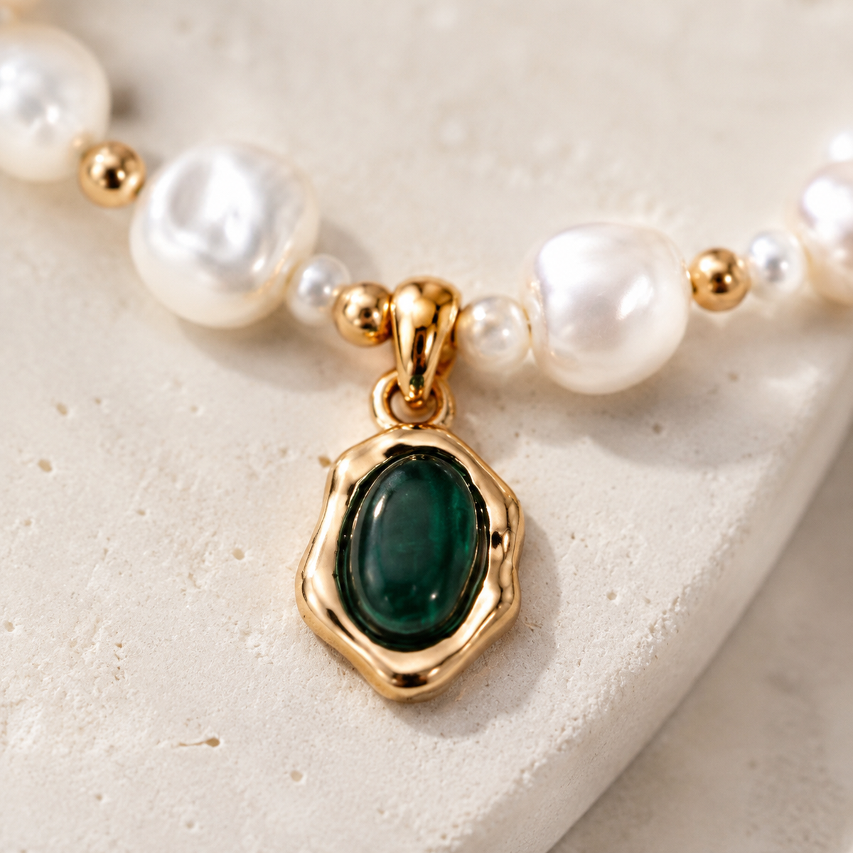 Close-up of the Vintage Gold malachite pendant and natural pearls