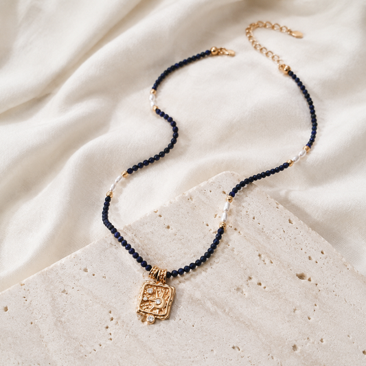 Vintage Gold Star Wish Lapis Pearl Necklace shown in full on an ivory display