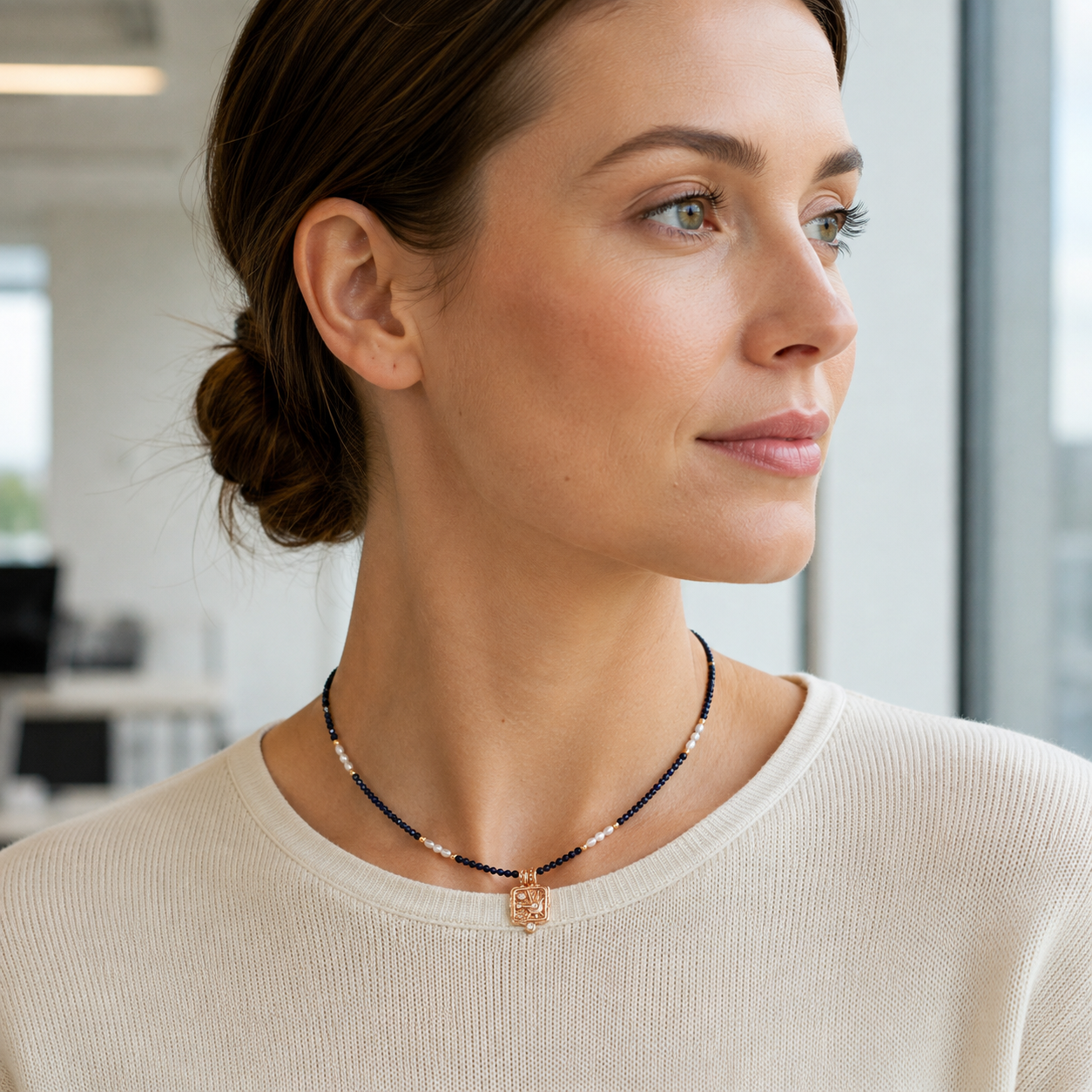 Model wearing the Vintage Gold Star Wish Lapis Pearl Necklace with a cream knit
